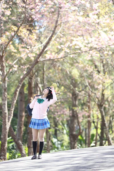 Asian schoolgirl with nature — Stock Photo, Image