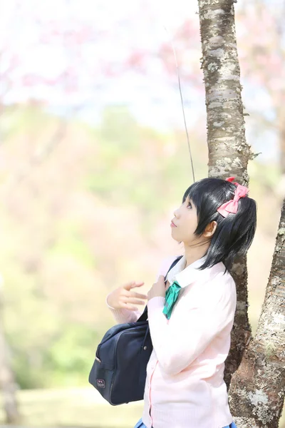 Asian schoolgirl with nature — Stock Photo, Image