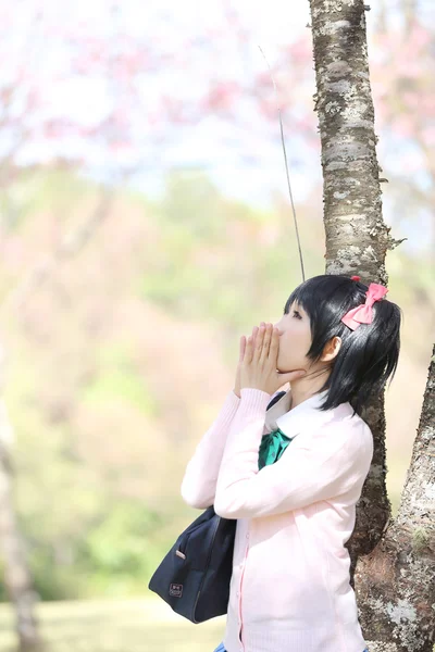 Asian schoolgirl with nature — Stock Photo, Image