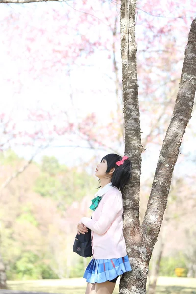 Asian schoolgirl with nature — Stock Photo, Image