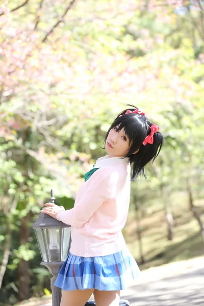 Asian schoolgirl with nature — Stock Photo, Image