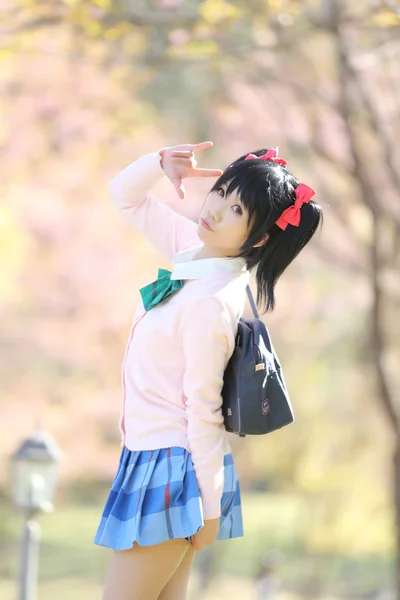 Asian schoolgirl with nature — Stock Photo, Image