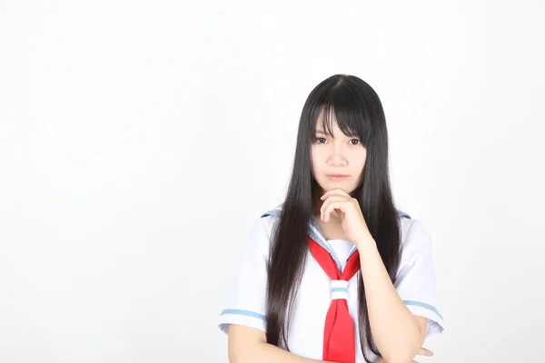 Aziatische school meisje geïsoleerd op witte achtergrond — Stockfoto