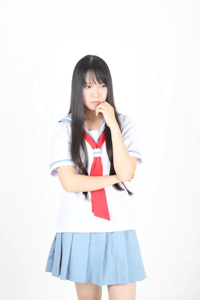 Aziatische school meisje geïsoleerd op witte achtergrond — Stockfoto