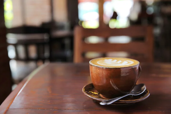 Kaffe på trä bakgrund — Stockfoto