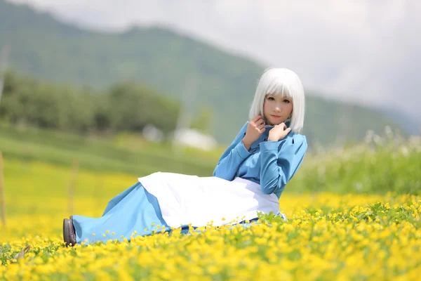 Asian cosplay girl yellow flowers — Stock Photo, Image