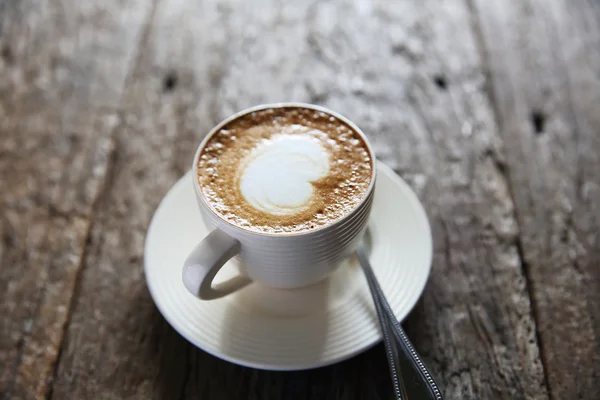 Koffie op hout achtergrond — Stockfoto