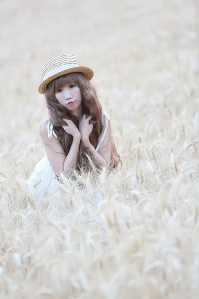 Asian girl on wheat — Stock Photo, Image