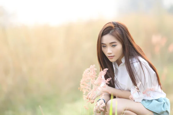 Asian girl on wheat field — Stock Photo, Image
