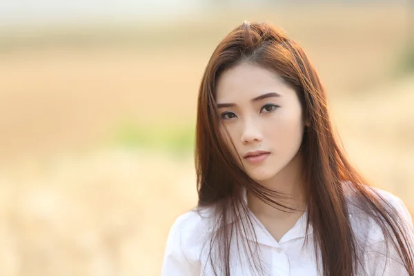 Asian girl on wheat field — Stock Photo, Image