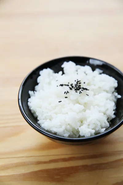 Rice with wood background — Stock Photo, Image