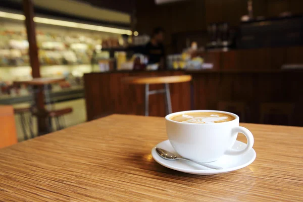 Koffie op hout achtergrond — Stockfoto