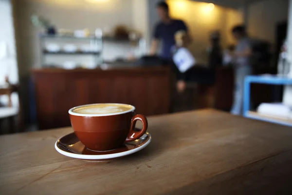 Café sobre fundo de madeira — Fotografia de Stock