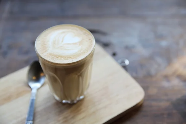 Kaffe på trä bakgrund — Stockfoto