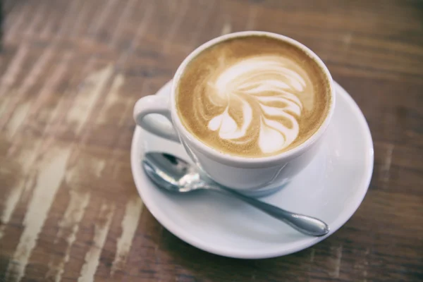 Kaffee auf Holz Hintergrund — Stockfoto