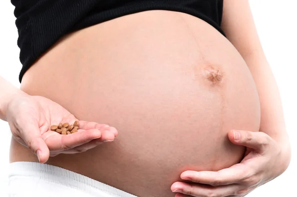 Mulher grávida em medicação — Fotografia de Stock