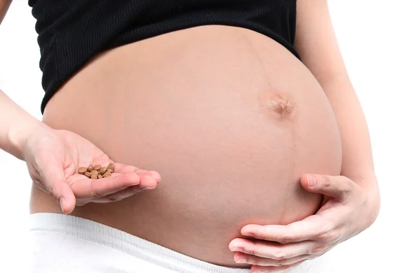 Těhotná žena na léky — Stock fotografie