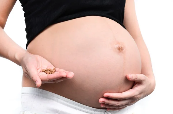 Беременная женщина на лекарствах — стоковое фото