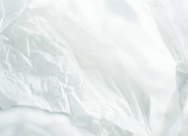 Beyaz buruşuk bir kağıt ya da bezden yapılmış harika ve güzel bir makro.