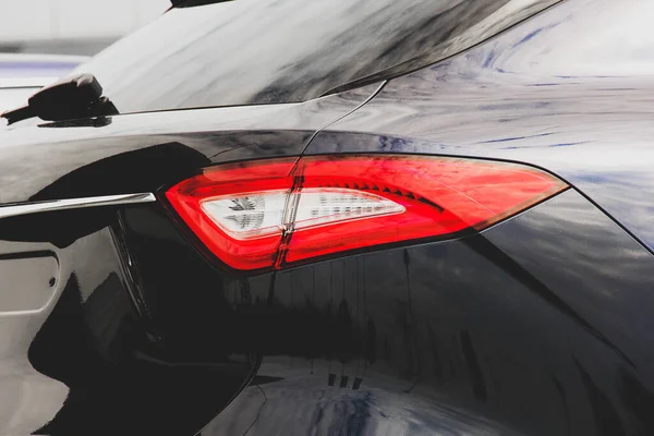 The back of the car. Car headlights. Luxury Headlights