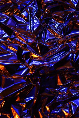 Folyo arka plan. Buruşuk folyo. Soyut arkaplan. Duvar kağıdı. Turuncu ve mavi 