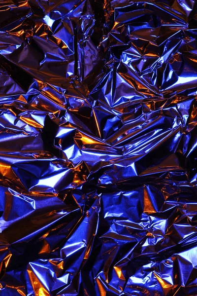 Folyo arka plan. Buruşuk folyo. Soyut arkaplan. Duvar kağıdı. Turuncu ve mavi