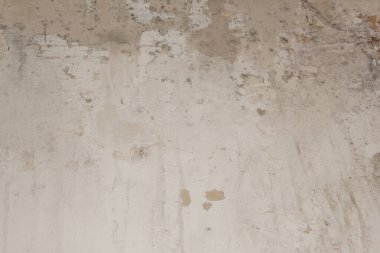 Kalitesiz macun arka planı. Eski bir geçmiş. Açık tonlu eski duvar