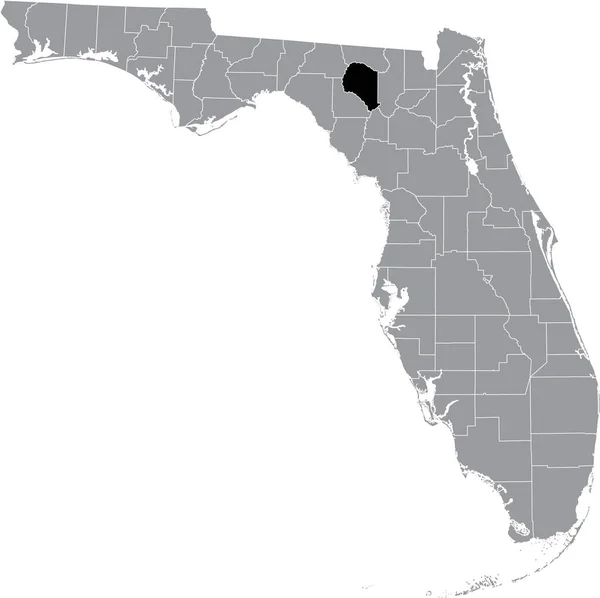 フロリダ州 の灰色の地図の中にある米国スワンニー郡の黒いハイライトされた場所 — ストックベクタ