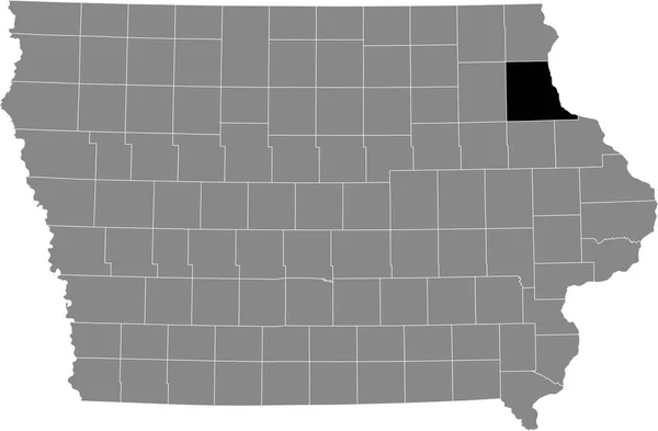 アメリカ合衆国アイオワ州の灰色の地図の中のクレイトン郡の黒いハイライトされた場所 — ストックベクタ