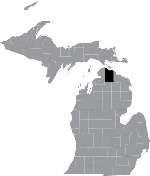 アメリカ合衆国ミシガン州の灰色の地図の中にあるチェビガン郡の黒いハイライトされた場所 — ストックベクタ