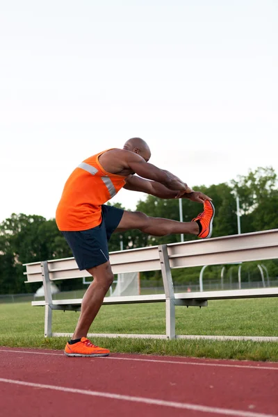 Pista e campo Runner Stretching — Foto Stock