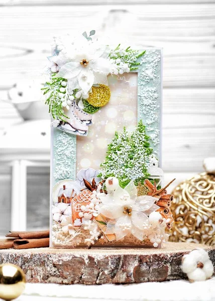 The handmade card, made with the technology of scrapbooking with cut and carved colourful elements