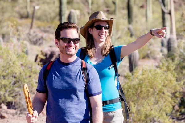 Desert Hiker Pointing with Friend