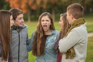 Startled Teens with Yelling Friend clipart