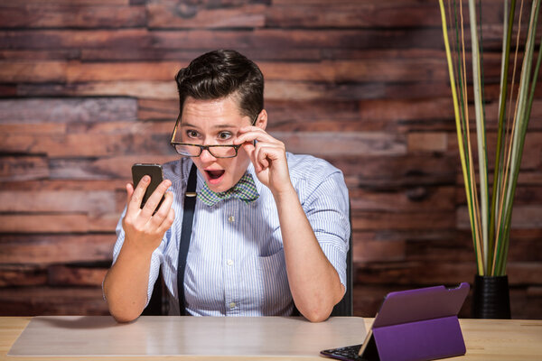 Businesswoman Looking Over Eyeglasses