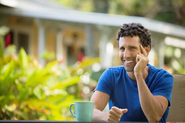 Laughing Man Sitting Outdoors — Stock Photo, Image