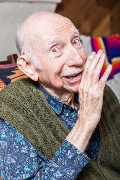 Elderly man sharing a secret — Stock Photo, Image