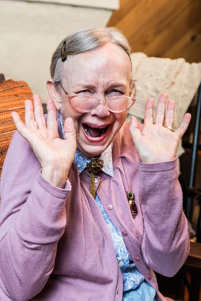 Old woman with hands up gesture — Stock Photo, Image