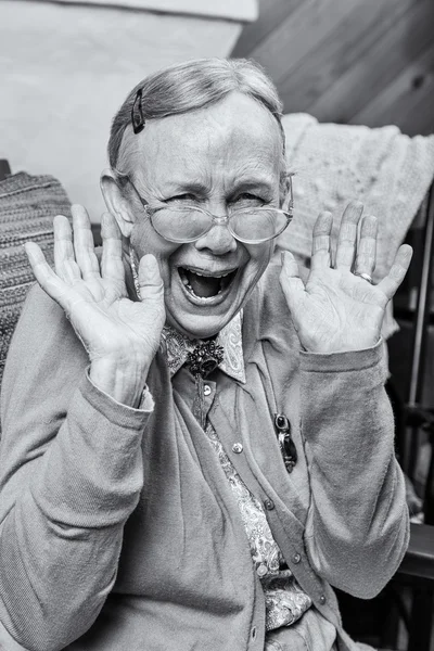 Elderly woman with a hands up gesture — Stock Photo, Image