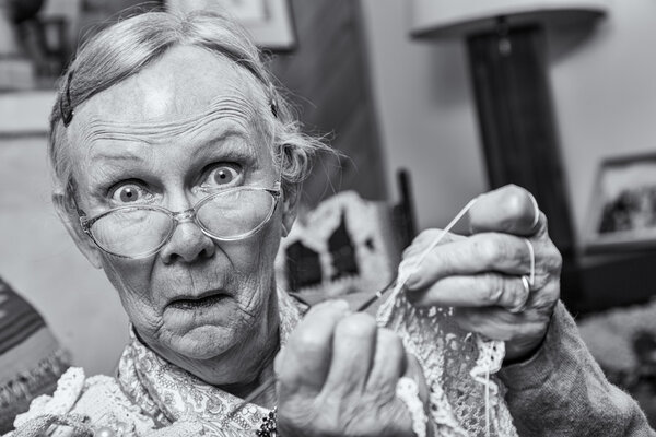 Surprised woman crocheting