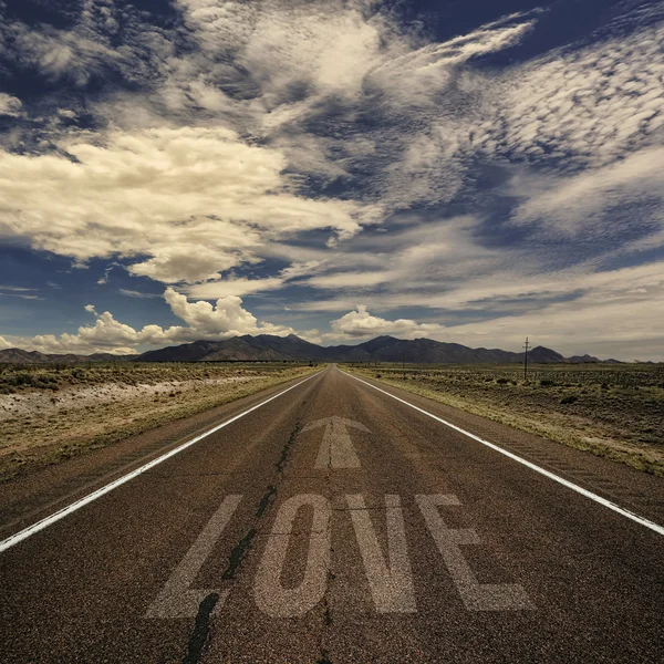 Desert road with the word love — Stock Photo, Image