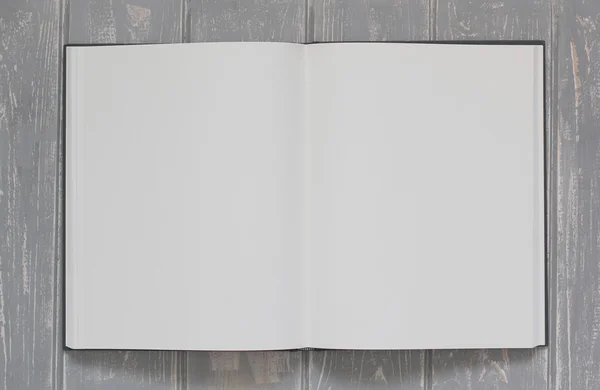 Notatbok på grått skrivebord av tre . – stockfoto