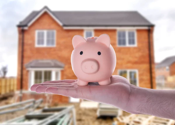 Hand Holding Piggy Bank Blurred Semi Detach House — Stock Photo, Image