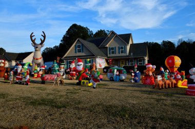 Merry Christmas blowup decorations at house front yard.