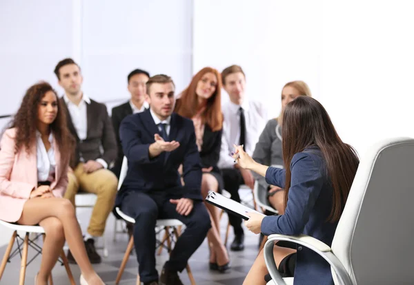 Young businessman sitting back — Stock Photo, Image