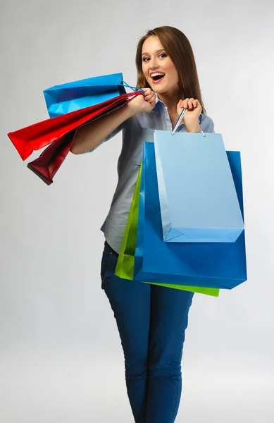 Mulher com pacotes de compras — Fotografia de Stock