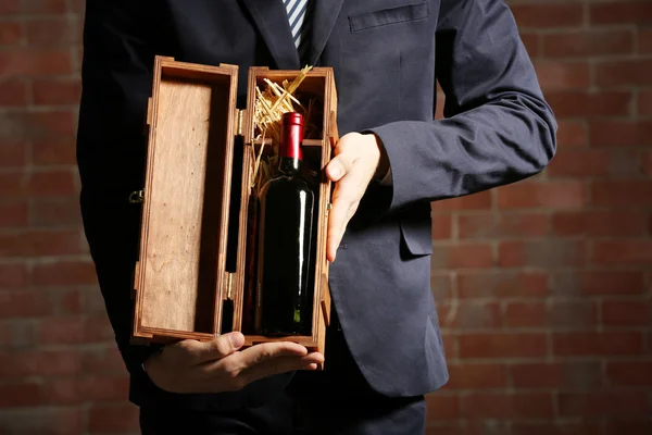 Man holding bottle of red wine Royalty Free Stock Images