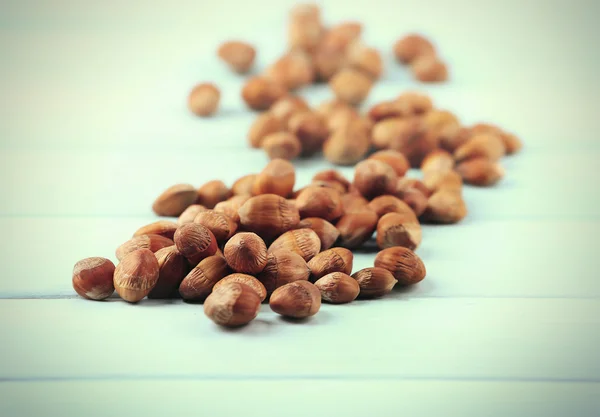 Hazelnuts on wooden background — Stock Photo, Image