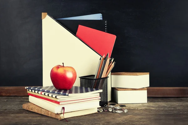 School supplies on old wooden table — Stock Photo, Image