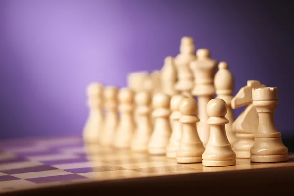 Chess pieces and game board — Stock Photo, Image